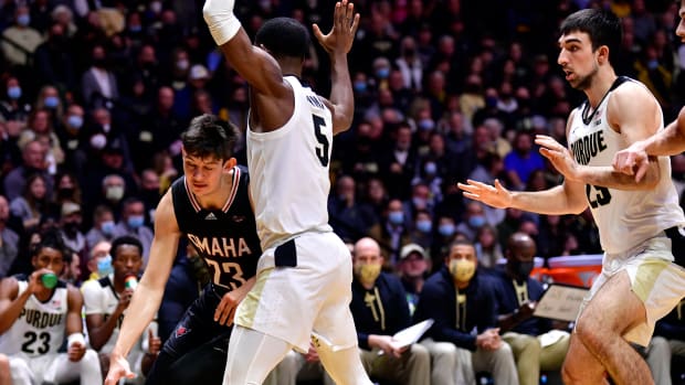 Nov 26, 2021; West Lafayette, Indiana, USA; Nebraska-Omaha Mavericks forward Frankie Fidler (23) drives the ball around Purdue Boilermakers guard Brandon Newman (5) during the first half at Mackey Arena.